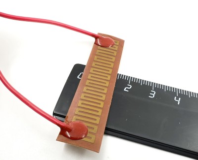 Нагревательная пластина 63х14мм (9V-5W, 12V-10W, 15.2 Ом) LFH-9408pg на клейкой основе