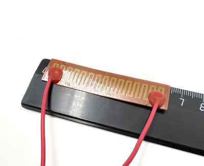 Нагревательная пластина 63х14мм (9V-5W, 12V-10W, 15.2 Ом) LFH-9408pg на клейкой основе