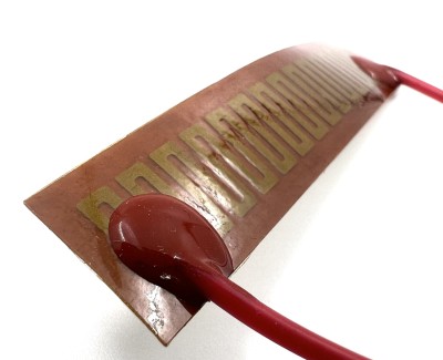Нагревательная пластина 63х14мм (9V-5W, 12V-10W, 15.2 Ом) LFH-9408pg на клейкой основе